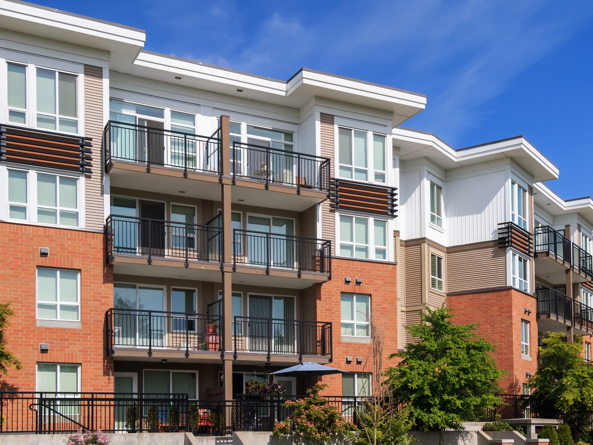 image of a 4 storey wood frame apartment building